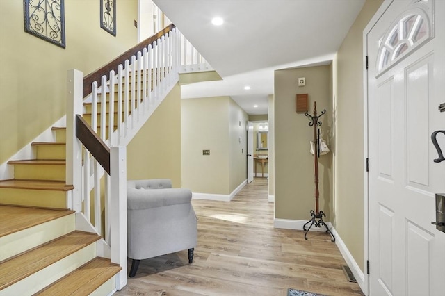 entryway with light hardwood / wood-style floors