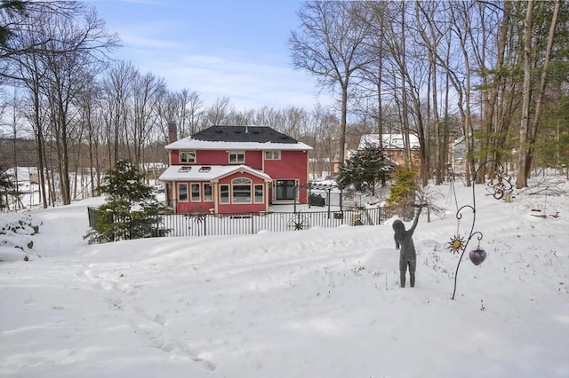 view of snow covered house