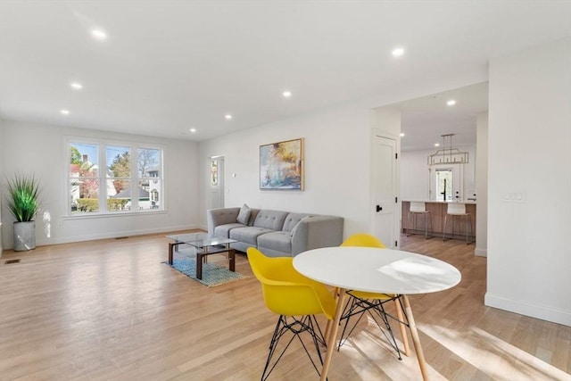 living room featuring recessed lighting and light wood finished floors
