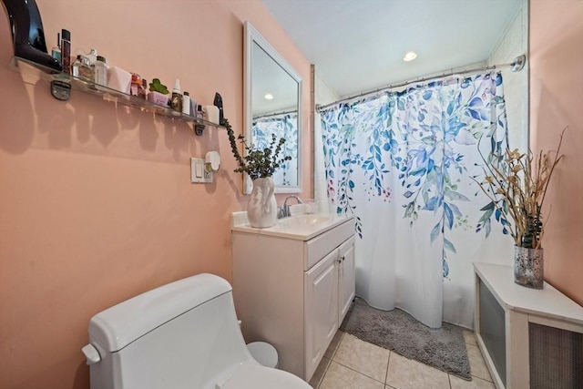 full bath featuring vanity, a shower with shower curtain, tile patterned floors, and toilet