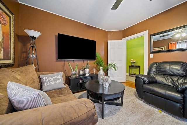 living area featuring a ceiling fan