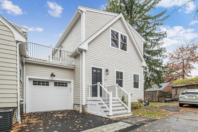 view of front of home with a balcony and cooling unit