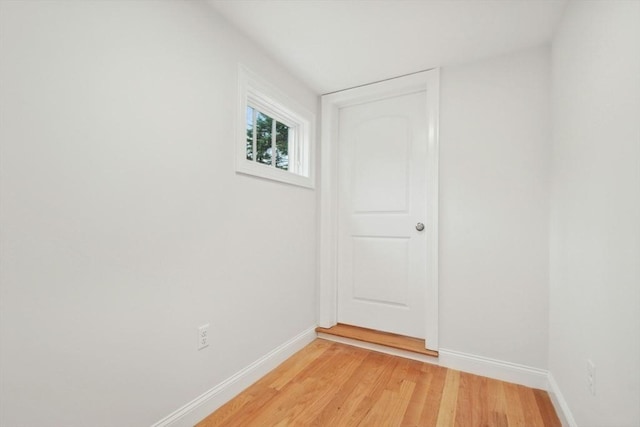 spare room with wood-type flooring