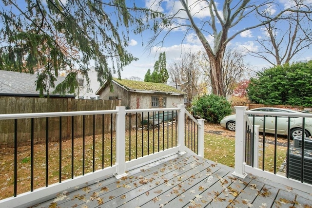 wooden terrace with an outdoor structure