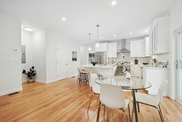 dining room featuring light hardwood / wood-style floors