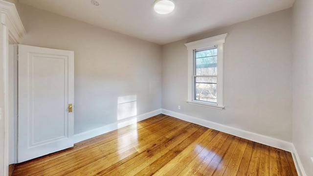 spare room with hardwood / wood-style floors