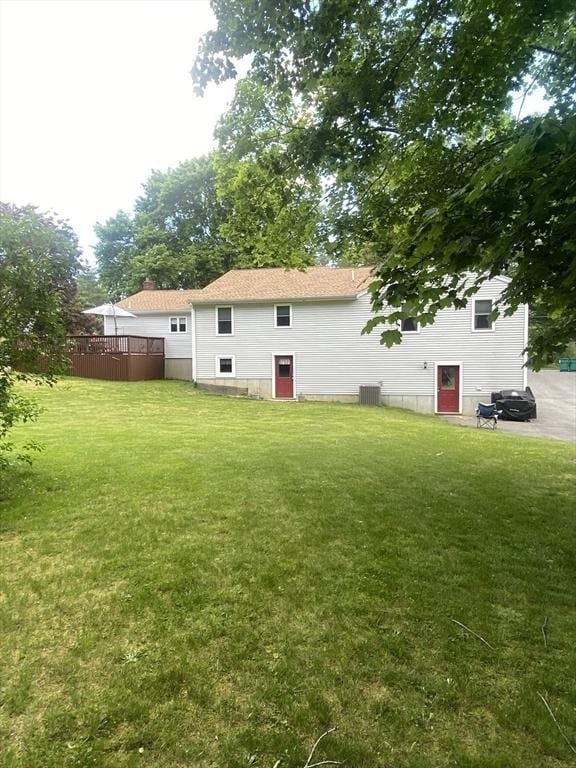 9 Pine City Rd, Carver, MA 02330 - back of property with central AC and a lawn