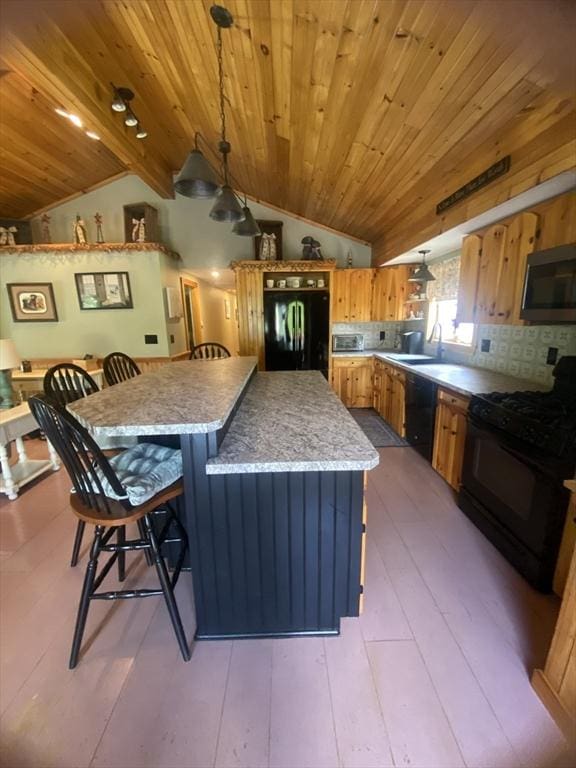 9 Pine City Rd, Carver, MA 02330 - kitchen featuring black appliances, lofted ceiling, wooden ceiling, a kitchen island, and a breakfast bar