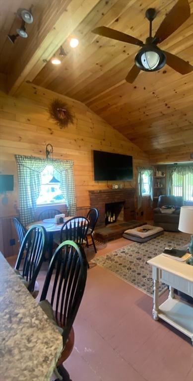 9 Pine City Rd, Carver, MA 02330 - living area with wood ceiling, wooden walls, a fireplace, vaulted ceiling, and ceiling fan