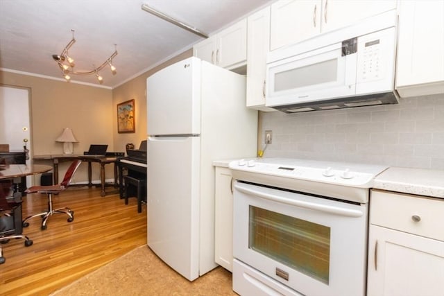 5 Cass St Unit 12, Boston, MA 02132 - kitchen with white appliances, crown molding, white cabinets, decorative backsplash, and light countertops