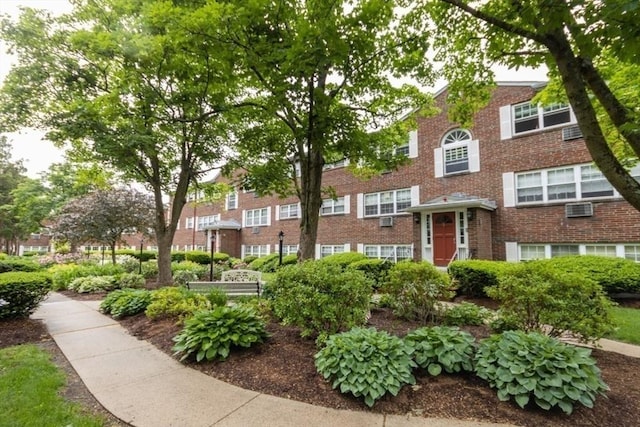 5 Cass St Unit 12, Boston, MA 02132 - view of front of house with brick siding and an AC wall unit