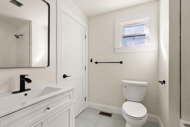 full bathroom with toilet, baseboards, walk in shower, tile patterned flooring, and vanity