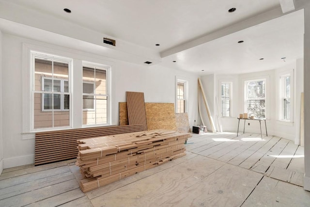 interior space with recessed lighting, baseboards, and plenty of natural light