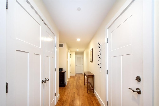 hall with light wood-type flooring