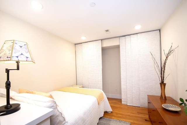 bedroom featuring hardwood / wood-style flooring