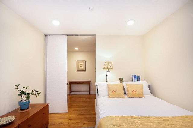 bedroom with light wood-type flooring