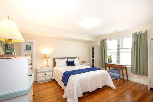 bedroom with wood-type flooring