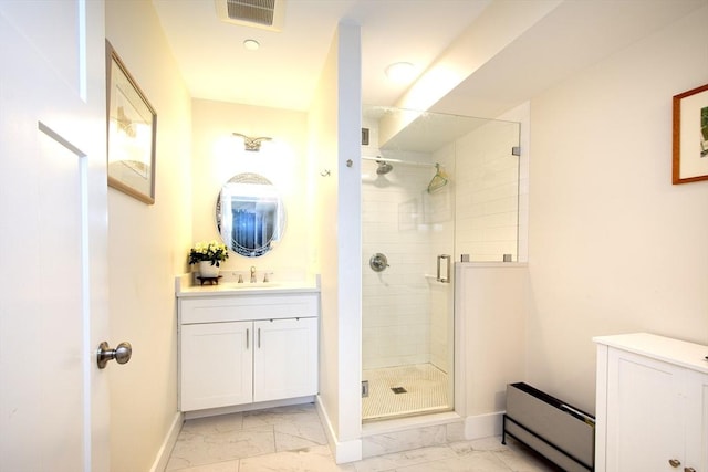 bathroom with vanity, a baseboard radiator, and a shower with shower door