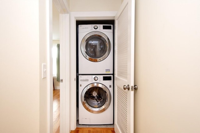 laundry area with stacked washer / drying machine