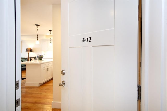 hallway with light wood-type flooring