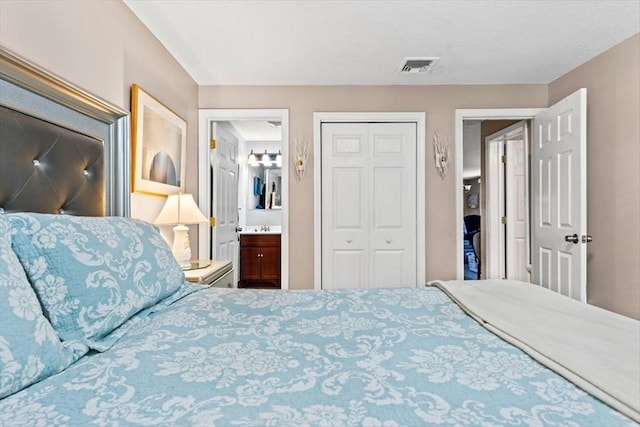 bedroom featuring ensuite bathroom and a closet