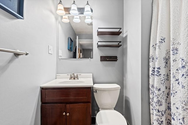 bathroom featuring vanity and toilet