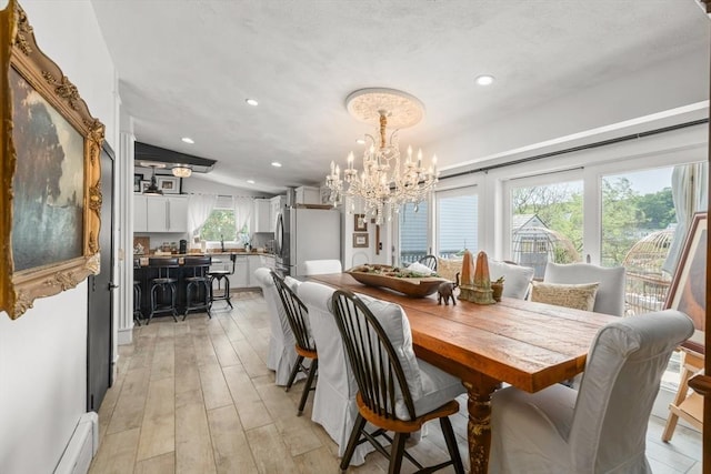 6 Rio, Gloucester, MA 01930 - dining room with a chandelier, baseboard heating, light wood finished floors, and recessed lighting