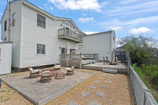 6 Rio, Gloucester, MA 01930 - back of property with a storage unit, a patio, a deck, and a balcony