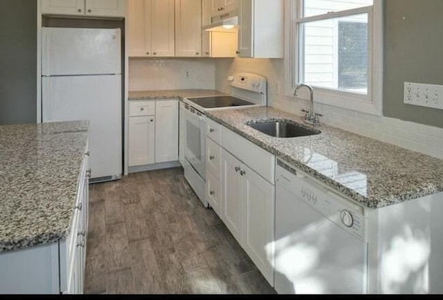 6 Rio, Gloucester, MA 01930 - kitchen with white appliances, backsplash, white cabinets, and under cabinet range hood