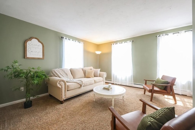 living room with baseboards, baseboard heating, and a wealth of natural light