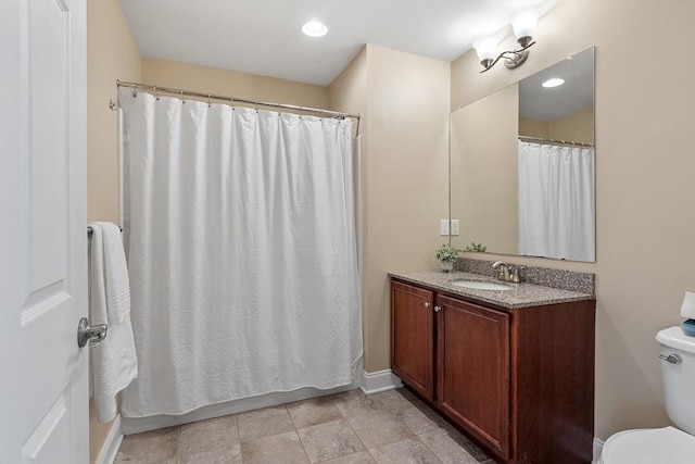 bathroom with toilet and vanity