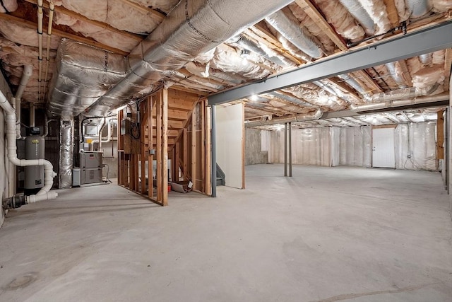 basement with heating unit and water heater