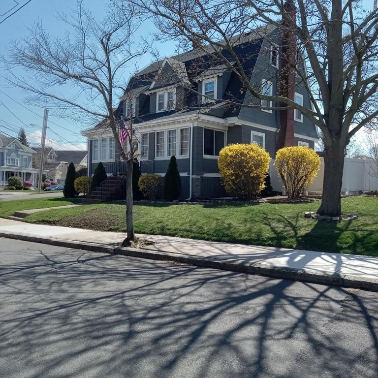 view of front of house with a front lawn and a residential view