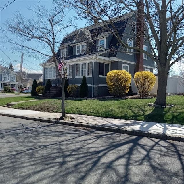 view of front of house with a front lawn and a residential view