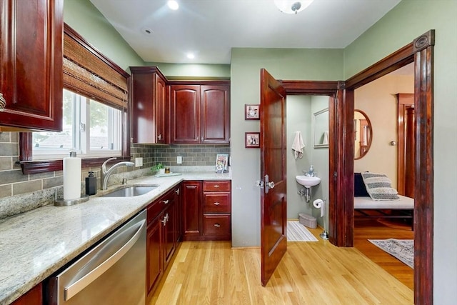 19 Orlando Ave, Winthrop, MA 02152 - kitchen with stainless steel dishwasher, dark brown cabinets, light wood-style floors, a sink, and recessed lighting