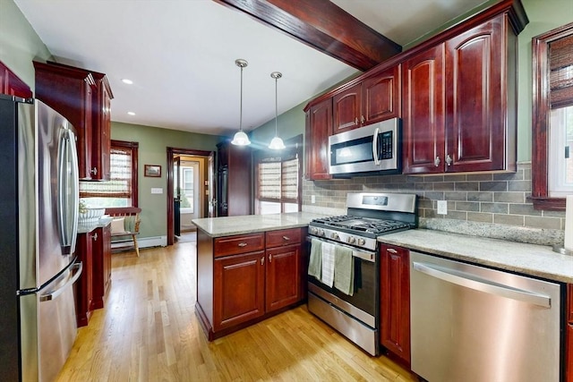 19 Orlando Ave, Winthrop, MA 02152 - kitchen featuring stainless steel appliances, dark brown cabinets, a peninsula, light wood-style floors, and recessed lighting