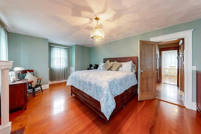 19 Orlando Ave, Winthrop, MA 02152 - bedroom featuring light wood finished floors, a chandelier, and baseboards