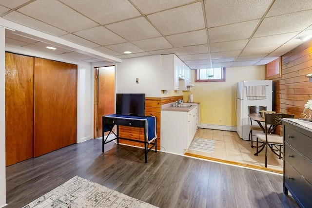 19 Orlando Ave, Winthrop, MA 02152 - laundry area with a sink, wood finished floors, wood walls, and baseboards