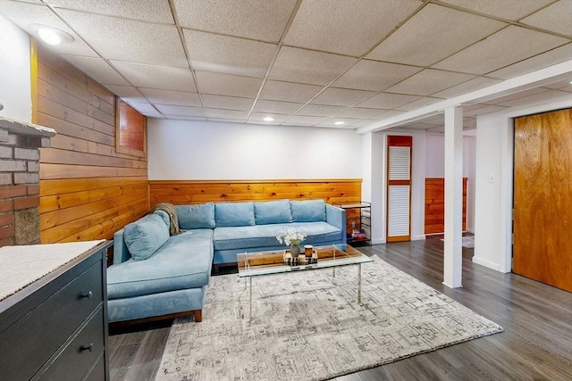19 Orlando Ave, Winthrop, MA 02152 - living area featuring wood walls, wood finished floors, a drop ceiling, recessed lighting, and wainscoting