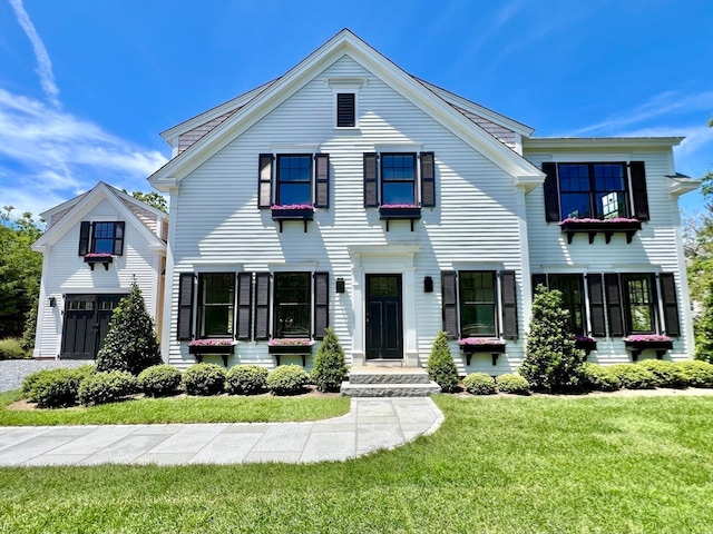 view of front of house with a front lawn