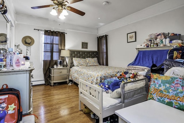 87 Lilley Ave, Lowell, MA 01850 - bedroom featuring wood finished floors, ornamental molding, baseboard heating, and a ceiling fan