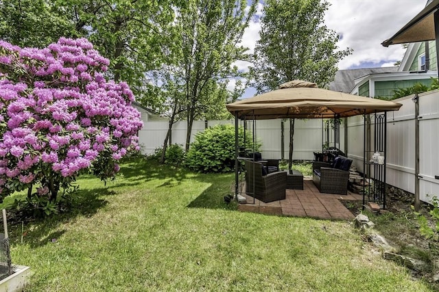 87 Lilley Ave, Lowell, MA 01850 - fenced backyard with a gazebo, an outdoor living space, and a patio