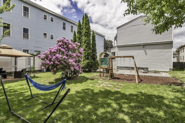 87 Lilley Ave, Lowell, MA 01850 - view of grassy yard with a gazebo and a patio area