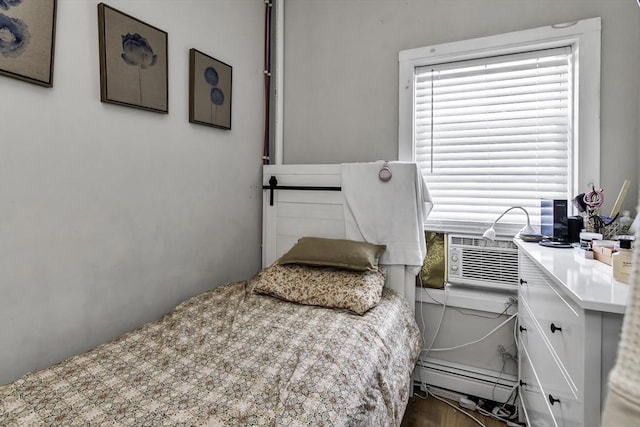 87 Lilley Ave, Lowell, MA 01850 - bedroom with cooling unit, a desk, and a baseboard radiator