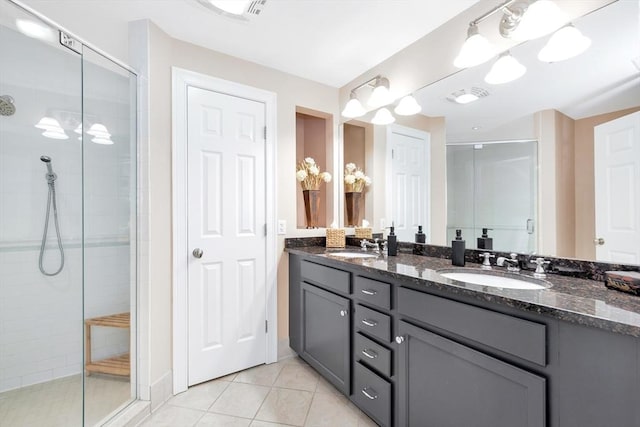 95 Conant St Unit 404, Concord, MA 01742 - bathroom with a stall shower, double vanity, and tile patterned floors