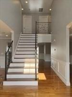 41 Rustic Dr, Worcester, MA 01609 - stairway with wood finished floors and a wainscoted wall