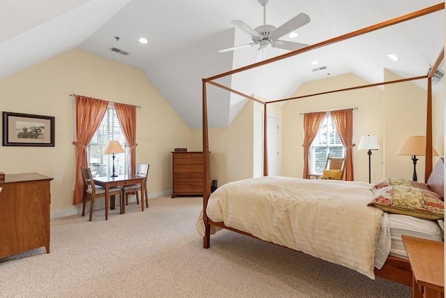 bedroom with lofted ceiling, multiple windows, visible vents, and baseboards