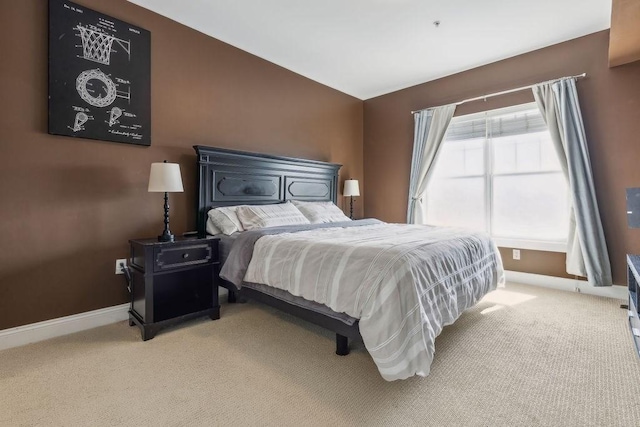 bedroom with baseboards and carpet floors
