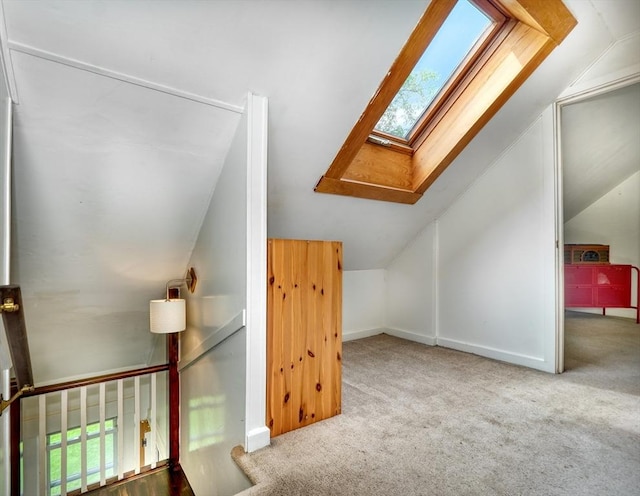 108 Needham St, Dedham, MA 02026 - additional living space featuring a skylight, lofted ceiling, carpet flooring, healthy amount of natural light, and baseboards