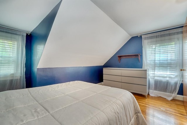 108 Needham St, Dedham, MA 02026 - bedroom with vaulted ceiling, wood finished floors, and baseboards